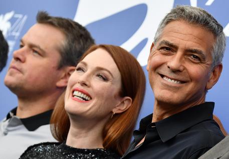 US director George Clooney (R) with US actors Matt Damon (L) and Julianne Moore (C) pose during a photocall for 'Suburbicon' at the 74th annual Venice International Film Festival, in Venice, Italy, 02 September 2017. The movie is presented in official competition 'Venezia 74' at the festival running from 30 August to 09 September. ANSA/ETTORE FERRARI